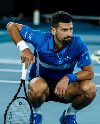 (250121) -- MELBOURNE, Jan. 21, 2025 -- Novak Djokovic reacts during the men s singles quarterfinal between Novak Djokovic of Serbia and Carlos Alcaraz of Spain at Australian Open tennis tournament in Melbourne, Australia, Jan. 21, 2025. ) (SP)AUSTRALIA-MELBOURNE-TENNIS-AUSTRALIAN OPEN-DAY 10 MaxPing 