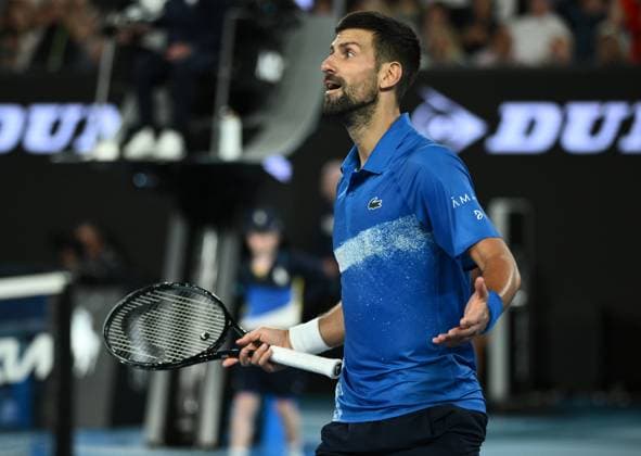 TENNIS AUSTRALIAN OPEN, Novak Djokovic of Serbia reacts during his 1 4 final match against Carlos Alcaraz of Spain during the 2025 Australian Open at Melbourne Park in Melbourne, Tuesday, January 21, 2025. ( NO ARCHIVING, EDITORIAL USE ONLY, NO USE IN BOOKS WITHOUT CONSENT MELBOURNE VICTORIA AUSTRALIA  Copyright: xJOELxCARRETTx 20250122176146988166