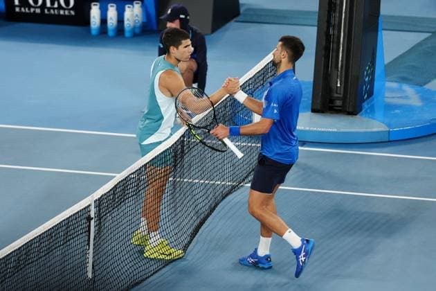 Novak Djokovic and Carlos Alcaraz meet at the net after their Quarter-final match in the Rod Laver Arena Australian Open, Day Ten, Tennis, Melbourne Park, Melbourne, Australia - 21 Jan 2025  Copyright: xRachelxBach Shutterstockx 15108797gu