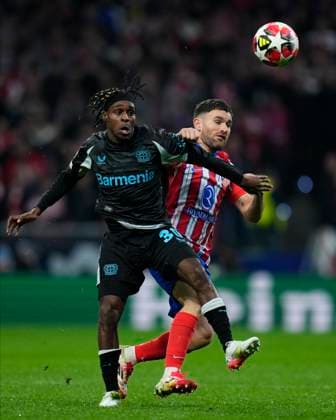 Champions League 2024 25 League match between Atletico de Madrid and Bayer Leverkusen Jeremie Frimpong of Bayer Leverkusen and Javier Galan of Atletico de Madrid during the UEFA Champions League 2024 25 League match between Atletico de Madrid and Bayer Leverkusen at Riyadh Air Metropolitano on December 11, 2024 in Madrid, Spain MadridSpain  Copyright: xx