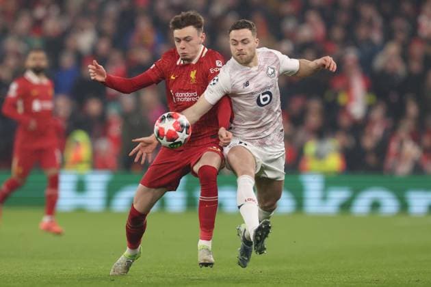 Conor Bradley of Liverpool and Gabriel Gudmundsson of Lille Liverpool v Lille, UEFA Champions League, Group Stage, Football, Anfield, Liverpool, UK - 21 Jan 2025 EDITORIAL USE ONLY No use with unauthorised audio, video, data, fixture lists, club league logos or live services. Online in-match use limited to 120 images, no video emulation. No use in betting, games or single club league player publications. Copyright: xPaulxCurrie Shutterstockx 15108882d