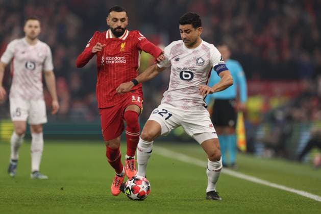 Mohamed Salah of Liverpool and Benjamin Andrà of Lille Liverpool v Lille, UEFA Champions League, Group Stage, Football, Anfield, Liverpool, UK - 21 Jan 2025 EDITORIAL USE ONLY No use with unauthorised audio, video, data, fixture lists, club league logos or live services. Online in-match use limited to 120 images, no video emulation. No use in betting, games or single club league player publications. Copyright: xPaulxCurrie Shutterstockx 15108882f