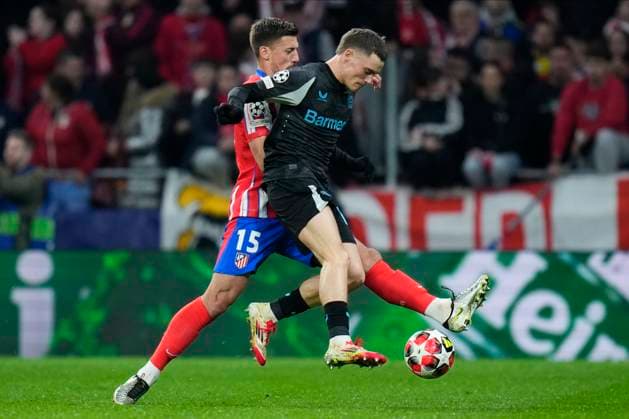 Champions League 2024 25 League match between Atletico de Madrid and Bayer Leverkusen Florian Wirtz of Bayer Leverkusen and Clement Lenglet of Atletico de Madrid during the UEFA Champions League 2024 25 League match between Atletico de Madrid and Bayer Leverkusen at Riyadh Air Metropolitano on December 11, 2024 in Madrid, Spain MadridSpain  Copyright: xx