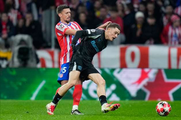 Champions League 2024 25 League match between Atletico de Madrid and Bayer Leverkusen Florian Wirtz of Bayer Leverkusen and Clement Lenglet of Atletico de Madrid during the UEFA Champions League 2024 25 League match between Atletico de Madrid and Bayer Leverkusen at Riyadh Air Metropolitano on December 11, 2024 in Madrid, Spain MadridSpain  Copyright: xx