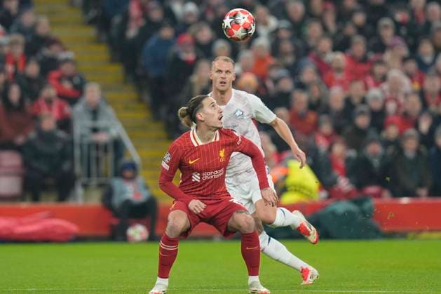 21st January 2025; Anfield, Liverpool, Merseyside, England; Champions League Football, Liverpool versus Lille; Kostas Tsimikas of Liverpool sets to head the ball clear in his goal area  ActionPlus12741665 StevenxFlynn