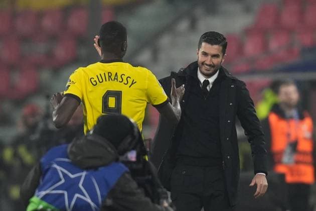 Dortmund& x2019;s Serhou Guirassy celebrates with Dortmund& x2019;s head coach Nuri Sahin after scoring the 0-1 goal for his team during the Uefa Champions League 2024 2025 soccer match between Bologna and Dortmund at Renato Dall Ara Stadium - Soccer - Bologna, Italy - Tuesday January 21, 2024  Copyright: xMassimoxPaolone LaPressex