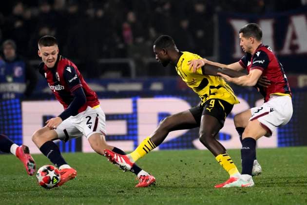 Emil Holm of Bologna FC, Serhou Guirassy of Borussia Dortmund and Remo Freuler of Bologna FC during the Champions League football match between Bologna FC and Borussia Dortmund at Renato Dall Ara stadium in Bologna (Italy), January 21, 2025. andreaxstaccioli