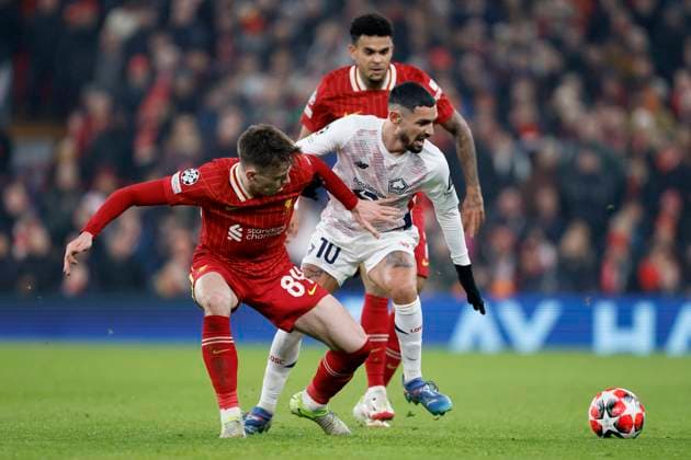 Liverpool FC v LOSC Lille - UEFA Champions League 2024 25 League Phase MD7 Conor Bradley of Liverpool and Remy Cabella of LOSC Lille challenge during the UEFA Champions League 2024 25 League Phase MD7 match between Liverpool FC and LOSC Lille at Anfield on January 21, 2025 in Liverpool, England. Liverpool Anfield England United Kingdom Copyright: xRichardxSellers Sportsphoto APLx 14057447