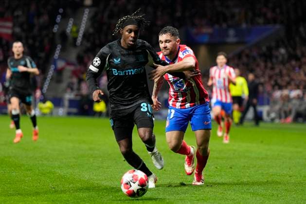 Champions League 2024 25 League match between Atletico de Madrid and Bayer Leverkusen Jeremie Frimpong of Bayer Leverkusen and Javier Galan of Atletico de Madrid during the UEFA Champions League 2024 25 League match between Atletico de Madrid and Bayer Leverkusen at Riyadh Air Metropolitano on December 11, 2024 in Madrid, Spain MadridSpain  Copyright: xx