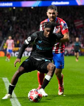 Champions League 2024 25 League match between Atletico de Madrid and Bayer Leverkusen Jeremie Frimpong of Bayer Leverkusen and Javier Galan of Atletico de Madrid during the UEFA Champions League 2024 25 League match between Atletico de Madrid and Bayer Leverkusen at Riyadh Air Metropolitano on December 11, 2024 in Madrid, Spain MadridSpain  Copyright: xx