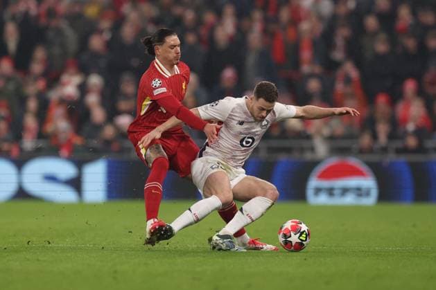 Darwin Nunez of Liverpool and Gabriel Gudmundsson of Lille Liverpool v Lille, UEFA Champions League, Group Stage, Football, Anfield, Liverpool, UK - 21 Jan 2025 EDITORIAL USE ONLY No use with unauthorised audio, video, data, fixture lists, club league logos or live services. Online in-match use limited to 120 images, no video emulation. No use in betting, games or single club league player publications.  Copyright: xPaulxCurrie Shutterstockx 15108882aa