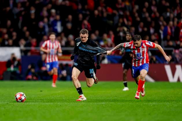 Florian Wirtz Bayer 04 Leverkusen and Javi Galan Atletico Madrid battle for the ball during the UEFA Champions League 2024 25 League Phase MD7 match between Atletico de Madrid and Bayer 04 Leverkusen at Estadio Civitas Metropolitano on January 21, 2025 in Madrid, Spain Photo by Manu Reino DeFodi Images Defodi 071 ATMLEV20250121 088 Defodi-071