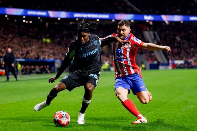 Jeremie Frimpong Bayer 04 Leverkusen and Javi Galan Atletico Madrid battle for the ball during the UEFA Champions League 2024 25 League Phase MD7 match between Atletico de Madrid and Bayer 04 Leverkusen at Estadio Civitas Metropolitano on January 21, 2025 in Madrid, Spain Photo by Manu Reino DeFodi Images Defodi 071 ATMLEV20250121 116 Defodi-071