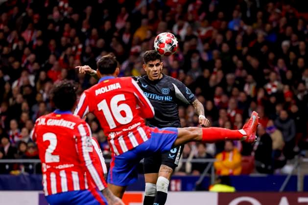 Nahuel Molina Atletico Madrid and Piero HincapiÃ Bayer 04 Leverkusen battle for the ball during the UEFA Champions League 2024 25 League Phase MD7 match between Atletico de Madrid and Bayer 04 Leverkusen at Estadio Civitas Metropolitano on January 21, 2025 in Madrid, Spain Photo by Manu Reino DeFodi Images Defodi 071 ATMLEV20250121 122 Defodi-071