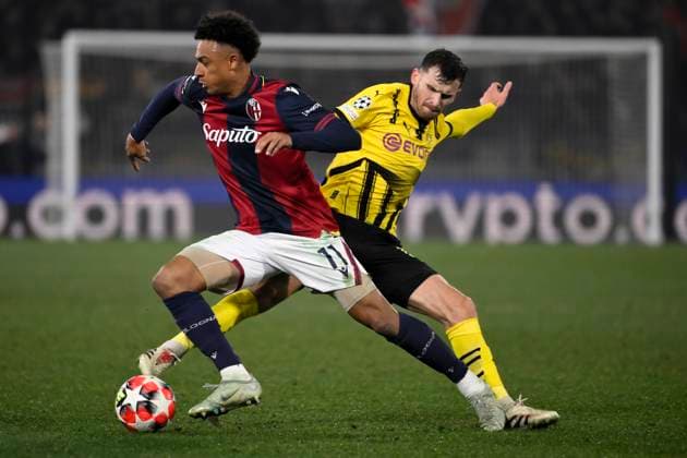 Dan Ndoye of Bologna FC and Pascal Gross of Borussia Dortmund compete for the ball during the Champions League football match between Bologna FC and Borussia Dortmund at Renato Dall Ara stadium in Bologna (Italy), January 21, 2025. andreaxstaccioli