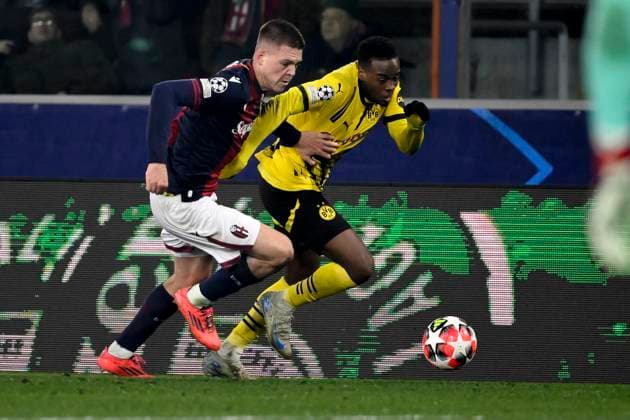 Emil Holm of Bologna FC and Jamie Jermaine Bynoe Gittens of Borussia Dortmund during the Champions League football match between Bologna FC and Borussia Dortmund at Renato Dall Ara stadium in Bologna (Italy), January 21, 2025. andreaxstaccioli