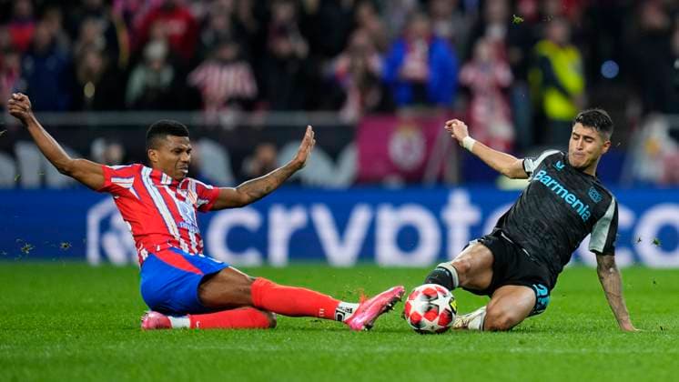Champions League 2024 25 League match between Atletico de Madrid and Bayer Leverkusen Reinildo Mandava of Atletico de Madrid and Exequiel Palacios of Bayer Leverkusen during the UEFA Champions League 2024 25 League match between Atletico de Madrid and Bayer Leverkusen at Riyadh Air Metropolitano on December 11, 2024 in Madrid, Spain MadridSpain  Copyright: xx