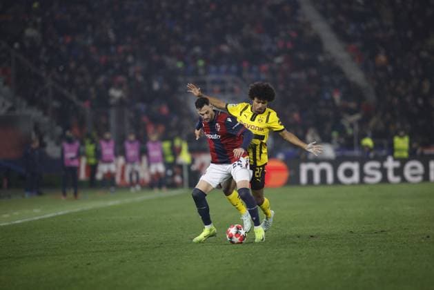 CALCIO - UEFA Champions League - Bologna FC vs Borussia Dortmund Charalampos Lykogiannis of Bologna FC and Karim Adeyemi of Borussia Dortmund during the IUefa Champions League, 2024 25 season, football match between Bologna FC 1909 and Borussia Dortmund on 21 January 2025 at Renato Dallâ??Ara Stadium, Bologna, Italy. Photo Nderim Kaceli Bologna Italy  Copyright: xIPAxSport ABACAx