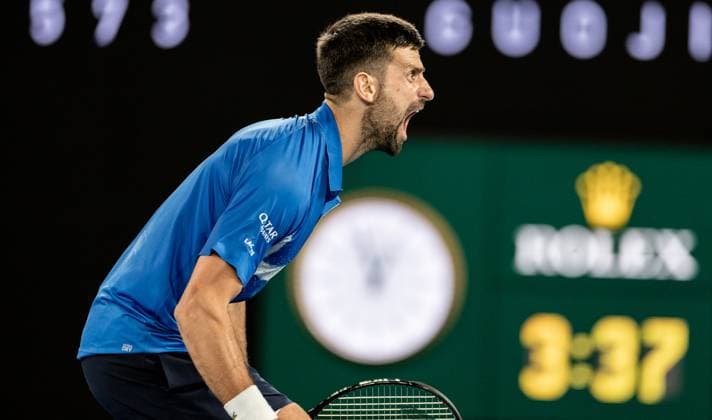 (250122) -- MELBOURNE, Jan. 22, 2025 -- Novak Djokovic celebrates winning the men s singles quarterfinal between Novak Djokovic of Serbia and Carlos Alcaraz of Spain at Australian Open tennis tournament in Melbourne, Australia, Jan. 21, 2025. (Photo by Xinhua) (SP)AUSTRALIA-MELBOURNE-TENNIS-AUSTRALIAN OPEN-DAY 10 HuxJingchen 