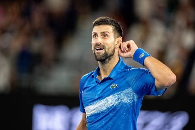 (250122) -- MELBOURNE, Jan. 22, 2025 -- Novak Djokovic reacts during the men s singles quarterfinal between Novak Djokovic of Serbia and Carlos Alcaraz of Spain at Australian Open tennis tournament in Melbourne, Australia, Jan. 21, 2025. (Photo by Xinhua) (SP)AUSTRALIA-MELBOURNE-TENNIS-AUSTRALIAN OPEN-DAY 10 HuxJingchen 