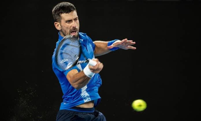 (250122) -- MELBOURNE, Jan. 22, 2025 -- Novak Djokovic hits a return during the men s singles quarterfinal between Novak Djokovic of Serbia and Carlos Alcaraz of Spain at Australian Open tennis tournament in Melbourne, Australia, Jan. 21, 2025. (Photo by Xinhua) (SP)AUSTRALIA-MELBOURNE-TENNIS-AUSTRALIAN OPEN-DAY 10 HuxJingchen 