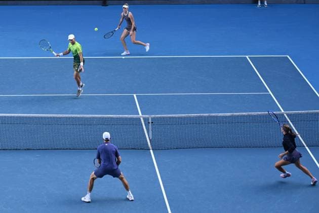 TENNIS AUSTRALIAN OPEN, Erin Routliffe and Michael Venus (top) of New Zealand during their Mixed doubles Semi-final match against Olivia Gadecki and John Peers during the 2025 Australian Open at Melbourne Park in Melbourne, Sunday, January 19, 2025. ( NO ARCHIVING, EDITORIAL USE ONLY, NO USE IN BOOKS WITHOUT CONSENT MELBOURNE VICTORIA AUSTRALIA  Copyright: xJOELxCARRETTx 20250122182034358571