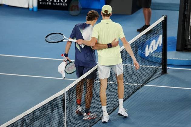 Jannik Sinner meets Alex de Minaur at the net after winning his Quarter-final match in the Rod Laver Arena Australian Open, Day Eleven, Tennis, Melbourne Park, Melbourne, Australia - 22 Jan 2025  Copyright: xRachelxBach Shutterstockx 15108798fw