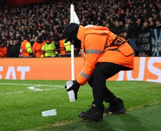 London, England, 22nd January 2025. Stewards clear up after Arsenal s Declan Rice looks on as he is pelted with objects during the UEFA Champions League match at the Emirates Stadium, London. Picture credit should read: David Klein Sportimage EDITORIAL USE ONLY. No use with unauthorised audio, video, data, fixture lists, club league logos or live services. Online in-match use limited to 120 images, no video emulation. No use in betting, games or single club league player publications. SPI_015_DK_Arsneal_Zagreb SPI-3614-0016