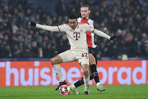 Soccer Champions League matchday 7 Feyenoord Rotterdam FC Bayern Munich on 22 01 2025 at Stadion Feijenoord in Rotterdam Jamal Musiala Munich , front Thomas Beelen Rotterdam , back xRx