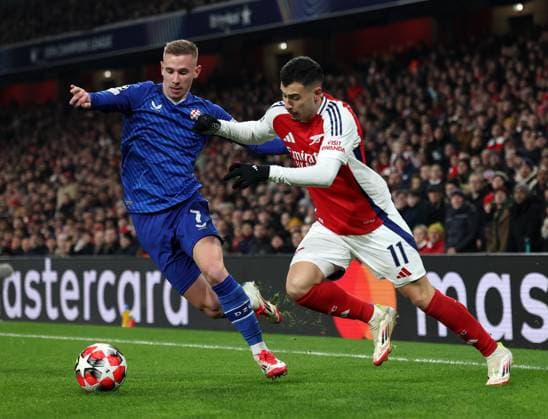 London, England, 22nd January 2025. Arsenal™s Gabriel Martinelli with Dinamo s Luka Stojkovic during the UEFA Champions League match at the Emirates Stadium, London. Picture credit should read: David Klein Sportimage EDITORIAL USE ONLY. No use with unauthorised audio, video, data, fixture lists, club league logos or live services. Online in-match use limited to 120 images, no video emulation. No use in betting, games or single club league player publications. SPI_025_DK_Arsneal_Zagreb SPI-3614-0024