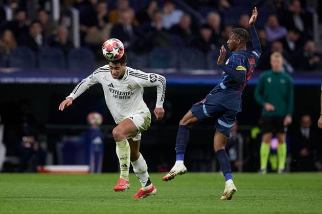 Jude Bellingham of Real Madrid CF and Dorgeles Nene of RB Salzburg Real Madrid v Red Bull Salzburg FC, UEFA Champions League, Football, Riyadh Air Metropolitano, Madrid, Spain - 22 Jan 2025 EDITORIAL USE ONLY No use with unauthorised audio, video, data, fixture lists, club league logos or live services. Online in-match use limited to 120 images, no video emulation. No use in betting, games or single club league player publications. Copyright: xRubenxAlbarran Shutterstockx 15112729j