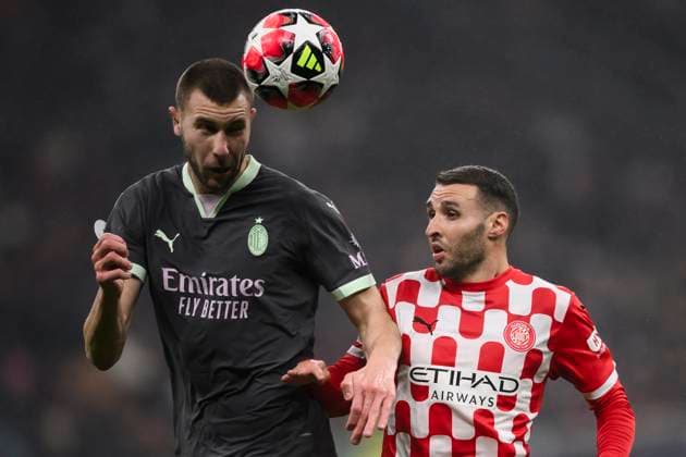 AC Milan v Girona FC - UEFA Champion League Abel Ruiz of Girona FC competes for a header with Strahinja Pavlovic of AC Milan during the UEFA Champions League 2024 25 league phase football match between AC Milan and Girona FC. Milan Italy Copyright: xNicolòxCampox