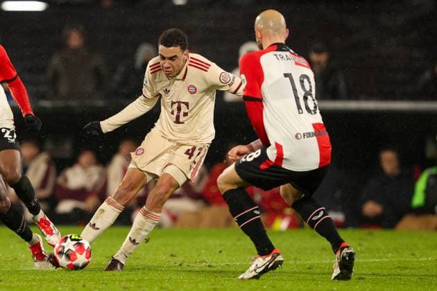 2025-01-22 Feyenoord v FC Bayern Munchen - Champions League - League phase - Matchday 7 ROTTERDAM, NETHERLANDS - JANUARY 22: Jamal Musiala of FC Bayern Munchen shoots the ball during the Champions League - League phase - Matchday 7 match between Feyenoord and FC Bayern Munchen at Stadion Feijenoord on January 22, 2025 in Rotterdam, Netherlands. Rotterdam Stadion Feijenoord Netherlands Content not available for redistribution in The Netherlands directly or indirectly through any third parties. Copyright: xHansxvanxderxValkx