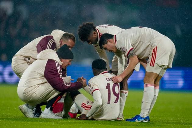 2025-01-22 Feyenoord v FC Bayern Munchen - Champions League - League phase - Matchday 7 ROTTERDAM, NETHERLANDS - JANUARY 22: Alphonso Davies of Bayern Munchen receives medical treatment during the Champions League - League phase - Matchday 7 match between Feyenoord and FC Bayern Munchen at Stadion Feijenoord on January 22, 2025 in Rotterdam, Netherlands. Rotterdam Stadion Feijenoord Netherlands Content not available for redistribution in The Netherlands directly or indirectly through any third parties. Copyright: xJorisxVerwijstx