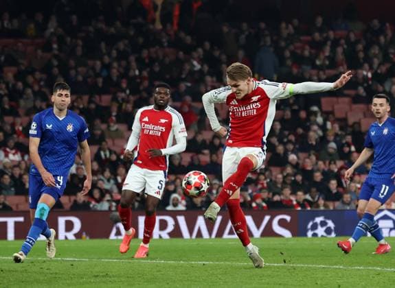 London, England, 22nd January 2025. Arsenal s Martin Odegaard scoring his sides third goal during the UEFA Champions League match at the Emirates Stadium, London. Picture credit should read: David Klein Sportimage EDITORIAL USE ONLY. No use with unauthorised audio, video, data, fixture lists, club league logos or live services. Online in-match use limited to 120 images, no video emulation. No use in betting, games or single club league player publications. SPI_056_DK_Arsneal_Zagreb SPI-3614-0055