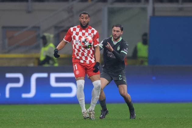 Milan, Italy, 22nd January 2025. Davide Calabria of AC Milan tussles with Arnaut Danjuma of Girona FC during the UEFA Champions League match at Giuseppe Meazza, Milan. Picture credit should read: Jonathan Moscrop Sportimage EDITORIAL USE ONLY. No use with unauthorised audio, video, data, fixture lists, club league logos or live services. Online in-match use limited to 120 images, no video emulation. No use in betting, games or single club league player publications. SPI_033_JM_MILAN_GIRONA_UCL SPI-3619-0005