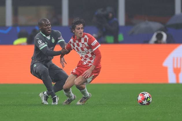 Milan, Italy, 22nd January 2025. Yunus Musah of AC Milan and Bryan Gil of Girona FC during the UEFA Champions League match at Giuseppe Meazza, Milan. Picture credit should read: Jonathan Moscrop Sportimage EDITORIAL USE ONLY. No use with unauthorised audio, video, data, fixture lists, club league logos or live services. Online in-match use limited to 120 images, no video emulation. No use in betting, games or single club league player publications. SPI_057_JM_MILAN_GIRONA_UCL SPI-3619-0029