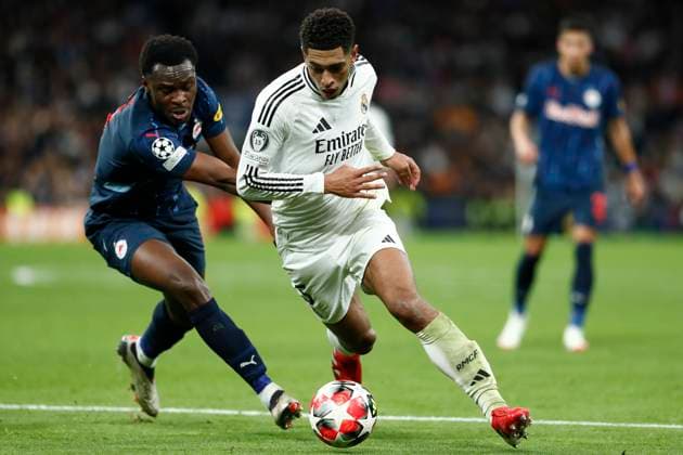 January 22, 2025, Madrid, Madrid, SPAIN: Samson Baidoo of RB Salzburg and Jude Bellingham of Real Madrid in action during the UEFA Champions League 2024 25 League Phase MD7 match between Real Madrid and RB Salzburg at Santiago Bernabeu stadium on January 22, 2025, in Madrid, Spain. Madrid SPAIN - ZUMAa181 20250122_zaa_a181_266 Copyright: xIrinaxR.xHipolitox