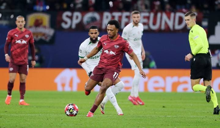 Lois Openda on the ball, Jerry St Juste duel Match scene Action Sport Football Soccer UEFA Champions League UCL Men 7 Matchday Season 2024 2025 22 01 2025 Rasen Ballsport RB Leipzig RBL vs Sporting Lisbon DFL regulations prohibit any use of photographs as image sequences and or quasi video