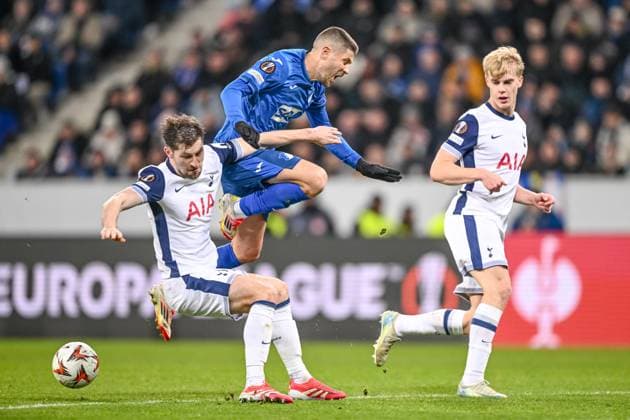 Ben Davies Tottenham Hotspur and Andrej Kramaric TSG 1899 Hoffenheim battle for the ball during the UEFA Europa League 2024 25 League Phase MD7 match between TSG 1899 Hoffenheim v Tottenham Hotspur at PreZero Arena on January 23, 2025 in Hoffenheim, Germany Photo by Harry Langer DeFodi Images Defodi 541 TSGTOT20250123 71 Defodi-541