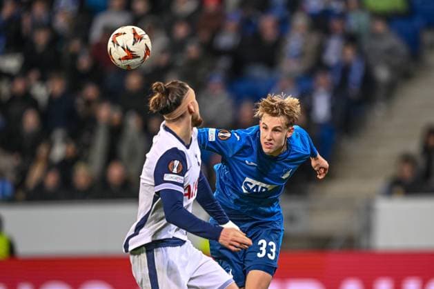 Radu Dragusin Tottenham Hotspur and Max Moerstedt TSG 1899 Hoffenheim battle for the ball during the UEFA Europa League 2024 25 League Phase MD7 match between TSG 1899 Hoffenheim v Tottenham Hotspur at PreZero Arena on January 23, 2025 in Hoffenheim, Germany Photo by Harry Langer DeFodi Images Defodi 541 TSGTOT20250123 76 Defodi-541