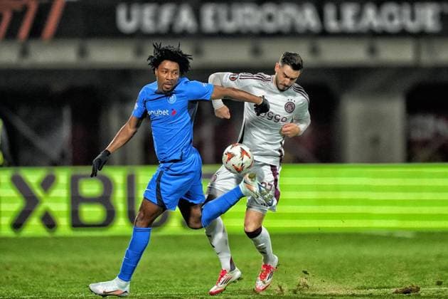 RIGA, 23-01-2025 , Daugava Stadium , football, UEFA Europa League, season 2024 2025, Match between RFS and Ajax. Ajax player Josip Sutalo and RFS player Cedric Kouadio RFS - Ajax  x27527659x Copyright: