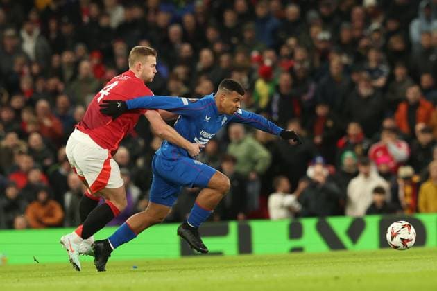 Matthijs de Ligt of Manchester United, ManU pulls Hamza Igamane of Rangers during the Europa League group phase match at Old Trafford, Manchester. Manchester United v Rangers, UEFA Europa League, Group Stage, Football, Old Trafford, Manchester, UK - 23 Jan 2025 EDITORIAL USE ONLY No use with unauthorised audio, video, data, fixture lists, club league logos or live services. Online in-match use limited to 120 images, no video emulation. No use in betting, games or single club league player publications. Copyright: xRangersxFC Shutterstockx 15111693df