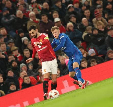 Bruno Fernandes of Manchester United, ManU and Connor Barron of Rangers during the Europa League group phase match at Old Trafford, Manchester. Manchester United v Rangers, UEFA Europa League, Group Stage, Football, Old Trafford, Manchester, UK - 23 Jan 2025 EDITORIAL USE ONLY No use with unauthorised audio, video, data, fixture lists, club league logos or live services. Online in-match use limited to 120 images, no video emulation. No use in betting, games or single club league player publications. Copyright: xRangersxFC Shutterstockx 15111693fa