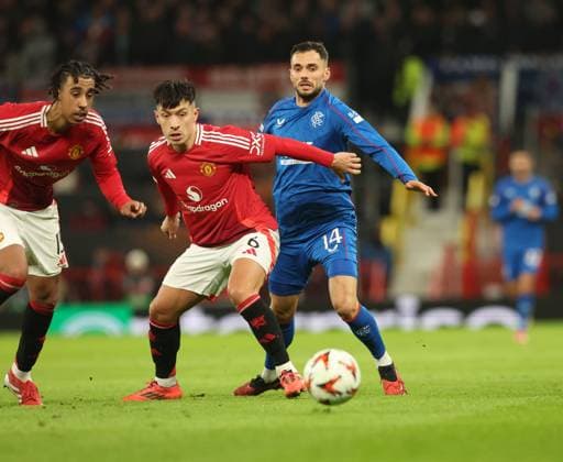 Lisandro Martinez and Leny Yoro of Manchester United, ManU battles for the ball with Nedim Bajrami of Rangers during the Europa League group phase match at Old Trafford, Manchester. Manchester United v Rangers, UEFA Europa League, Group Stage, Football, Old Trafford, Manchester, UK - 23 Jan 2025 EDITORIAL USE ONLY No use with unauthorised audio, video, data, fixture lists, club league logos or live services. Online in-match use limited to 120 images, no video emulation. No use in betting, games or single club league player publications. Copyright: xRangersxFC Shutterstockx 15111693fp