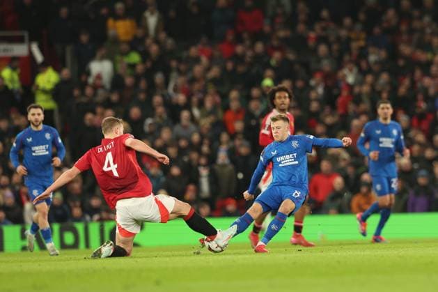Matthijs de Ligt of Manchester United, ManU and Connor Barron both go for the ball during the Europa League group phase match at Old Trafford, Manchester. Manchester United v Rangers, UEFA Europa League, Group Stage, Football, Old Trafford, Manchester, UK - 23 Jan 2025 EDITORIAL USE ONLY No use with unauthorised audio, video, data, fixture lists, club league logos or live services. Online in-match use limited to 120 images, no video emulation. No use in betting, games or single club league player publications. Copyright: xRangersxFC Shutterstockx 15111693fv