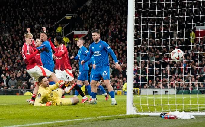Manchester, England, 23rd January 2025. Jack Butland of Rangers (grounded) punches the ball into his own net during the UEFA Europa League match at Old Trafford, Manchester. Picture credit should read: Andrew Yates Sportimage EDITORIAL USE ONLY. No use with unauthorised audio, video, data, fixture lists, club league logos or live services. Online in-match use limited to 120 images, no video emulation. No use in betting, games or single club league player publications. SPI_018_AY_MAN_UTD_RANGERS SPI-3616-0018