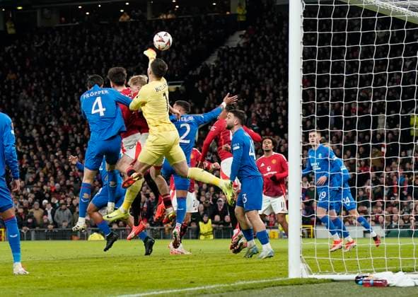 Manchester, England, 23rd January 2025. Jack Butland of Rangers (C) punches the ball into his own net during the UEFA Europa League match at Old Trafford, Manchester. Picture credit should read: Andrew Yates Sportimage EDITORIAL USE ONLY. No use with unauthorised audio, video, data, fixture lists, club league logos or live services. Online in-match use limited to 120 images, no video emulation. No use in betting, games or single club league player publications. SPI_020_AY_MAN_UTD_RANGERS SPI-3616-0020