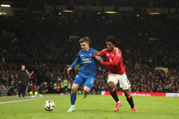 Ridvan Yilmaz of Rangers and Tyrell Malacia of Manchester United, ManU during the Europa League group phase match at Old Trafford, Manchester. Manchester United v Rangers, UEFA Europa League, Group Stage, Football, Old Trafford, Manchester, UK - 23 Jan 2025 EDITORIAL USE ONLY No use with unauthorised audio, video, data, fixture lists, club league logos or live services. Online in-match use limited to 120 images, no video emulation. No use in betting, games or single club league player publications. Copyright: xRangersxFC Shutterstockx 15111693ik