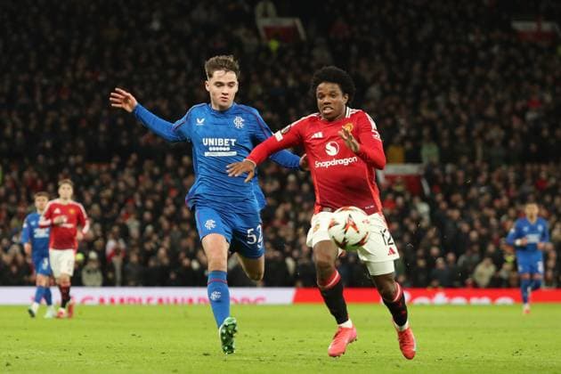 Findlay Curtis of Rangers and Tyrell Malacia of Manchester United, ManU during the Europa League group phase match at Old Trafford, Manchester. Manchester United v Rangers, UEFA Europa League, Group Stage, Football, Old Trafford, Manchester, UK - 23 Jan 2025 EDITORIAL USE ONLY No use with unauthorised audio, video, data, fixture lists, club league logos or live services. Online in-match use limited to 120 images, no video emulation. No use in betting, games or single club league player publications. Copyright: xRangersxFC Shutterstockx 15111693lg